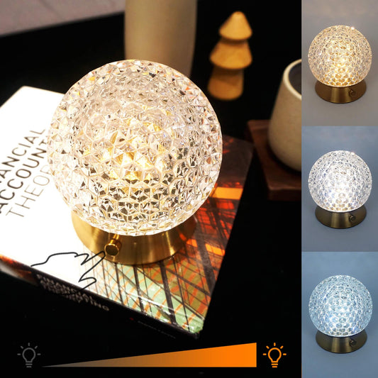 Cordless Rechargeable Lamp, Shining Star-Amingulry, the Gold cordless lamp which has 3 color modes is placed on a table, illuminating and decorating the table.