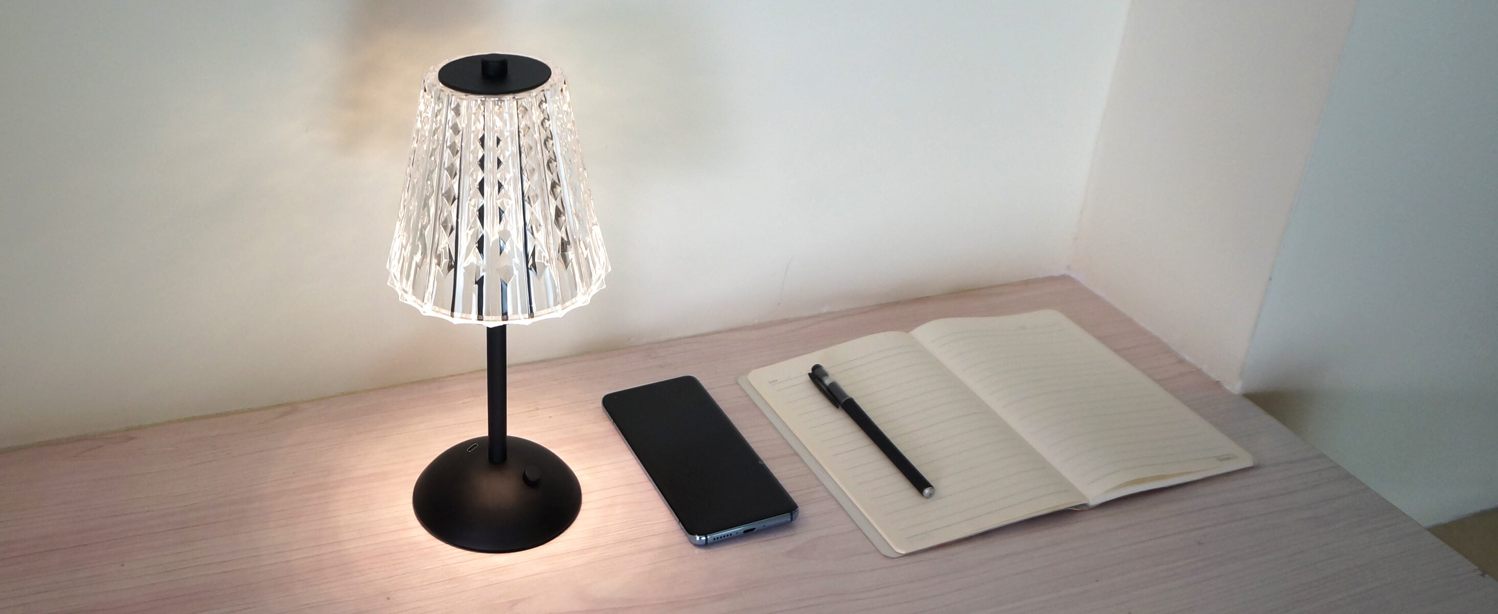 Cordless-Rechargeable-Battery, Modern-Black-Amingulry, illumination on the working desk.