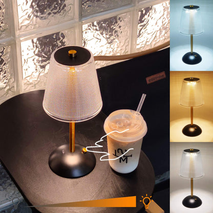 Cordless Rechargeable Lamp, Cube-Black&Gold-Amingulry, the Black&Gold cordless lamp which has 3 color modes is placed on a table, illuminating and decorating the cafe table.