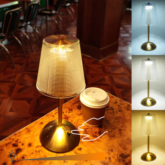 Cordless-Rechargeable-Battery-Retro-Gold-2000mAh, The golden cordless lamp which has 3 color modes is placed on a coffee table, illuminating and decorating the cafe.